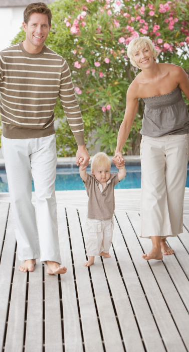couple-parents-with small-child-walking-on-deck